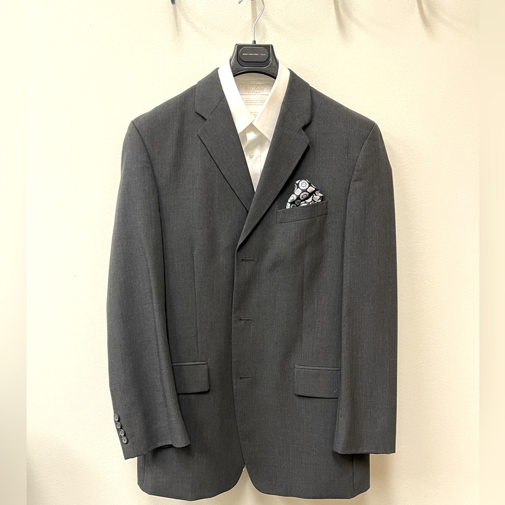 DKNY grey suit.  40L Shirt and pocket squares, not included.